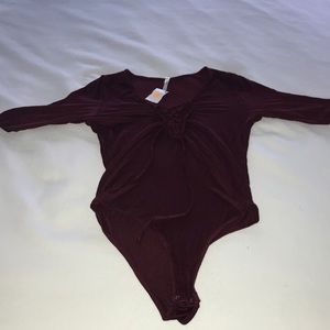 New burgundy shirt-sleeved bodysuit w tie-up front